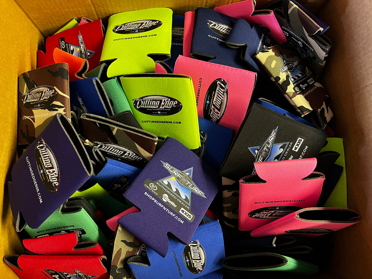 Colorful custom printed Cutting Edge and Surf N Turf can coolers