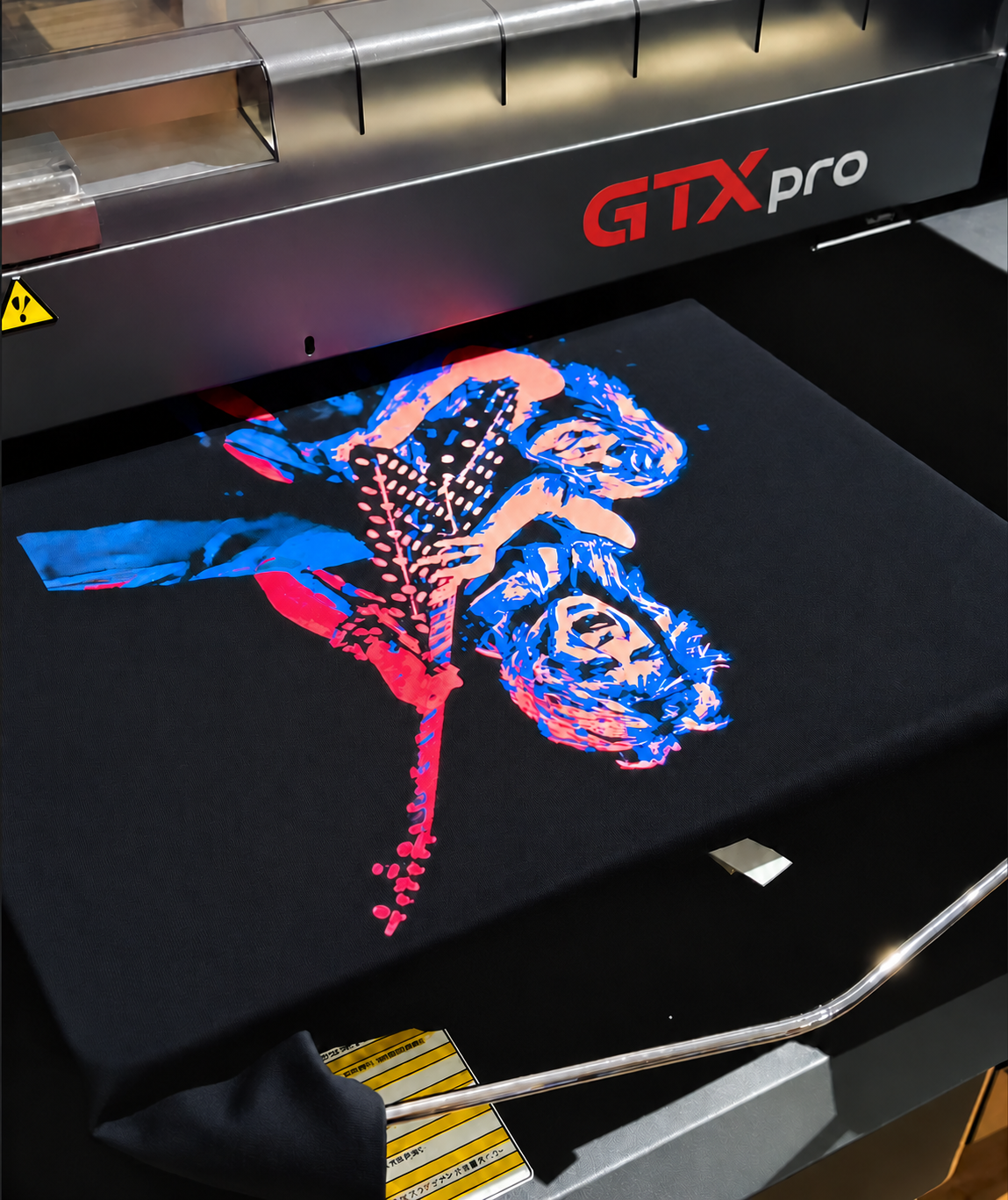 Colorful guitarist artwork being printed on a Brother GTXpro