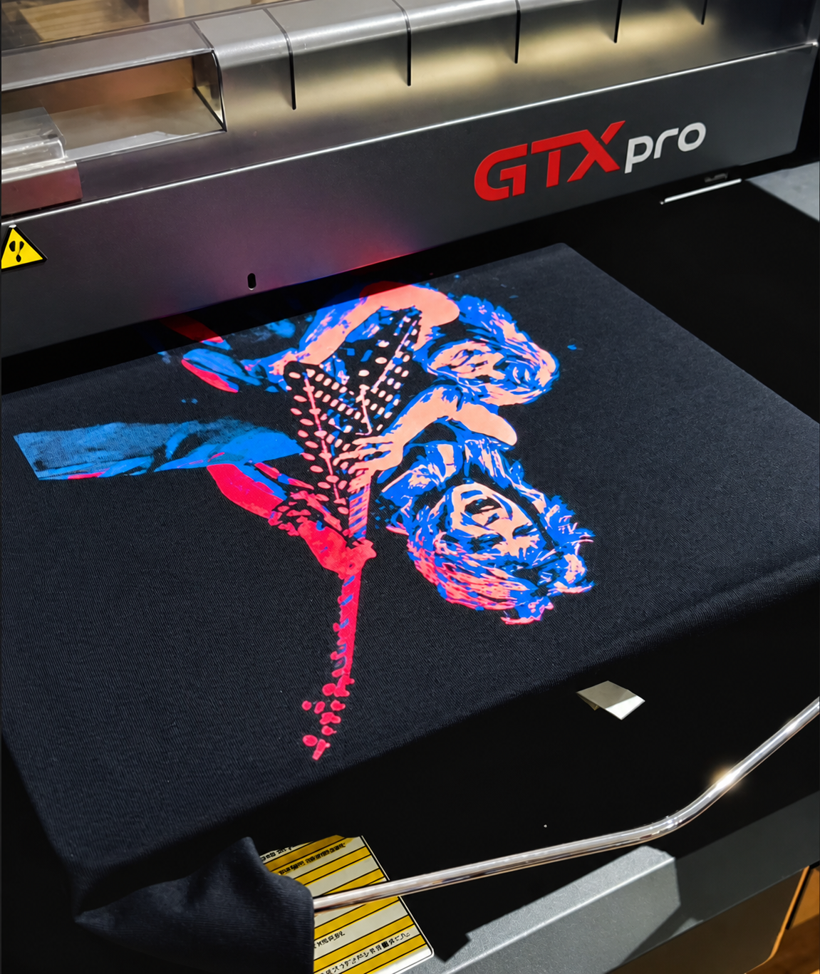 Colorful guitarist artwork being printed on a Brother GTXpro